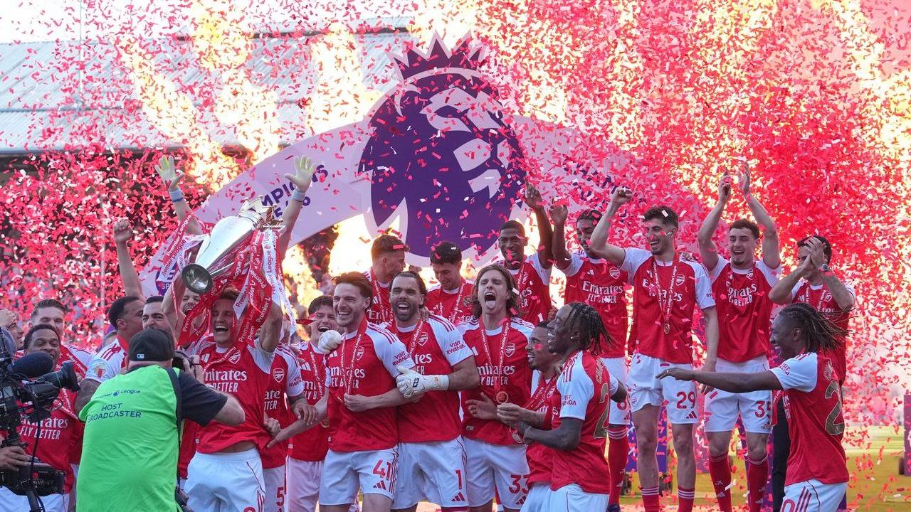 Celebrating the Premier League Trophy